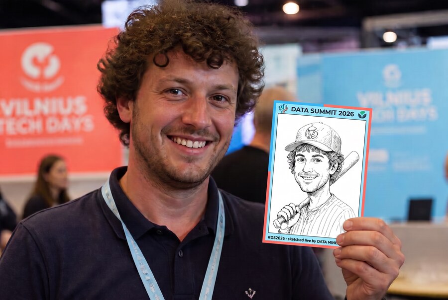 Grinning man with curly hair holding his baseball player caricature